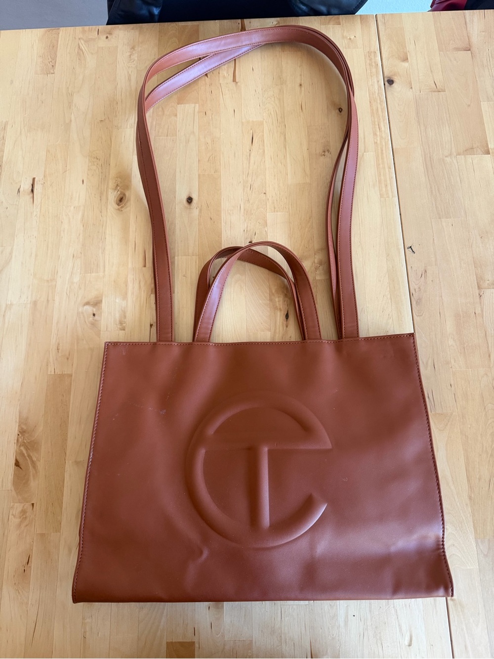 Telfar medium shopper in tan with Embossed Logo